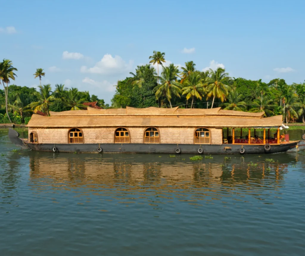 Kerala backwater houseboat experience with scenic canals, palm trees and peaceful waters